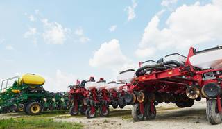 close-up-seeder-attached-tractor-field