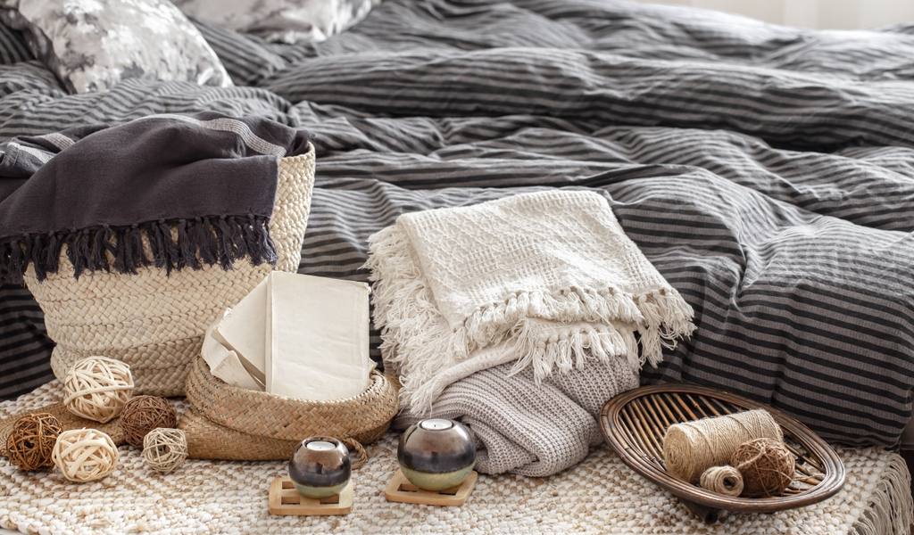 composition-with-candles-knitted-elements-other-decor-details-bedroom