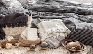 composition-with-candles-knitted-elements-other-decor-details-bedroom