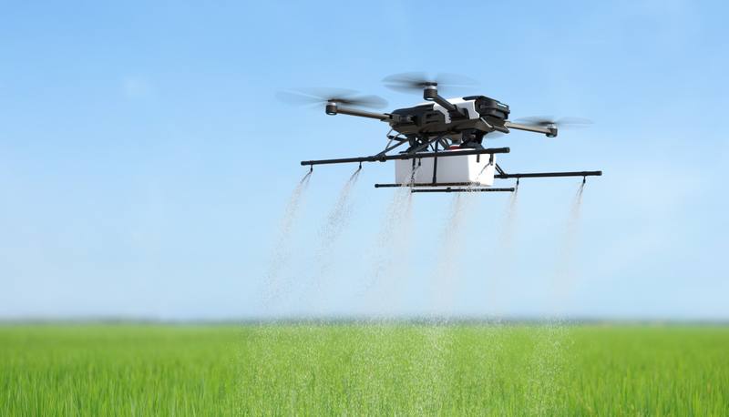 drone-spraying-fertilizer-vegetable-green-plants-agriculture-technology-farm-automation