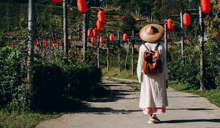 female-tourists-spread-their-arms-held-their-wings