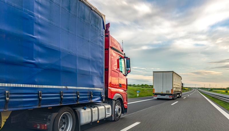 freight-trucks-driving-highway-logistics-road-transport-content