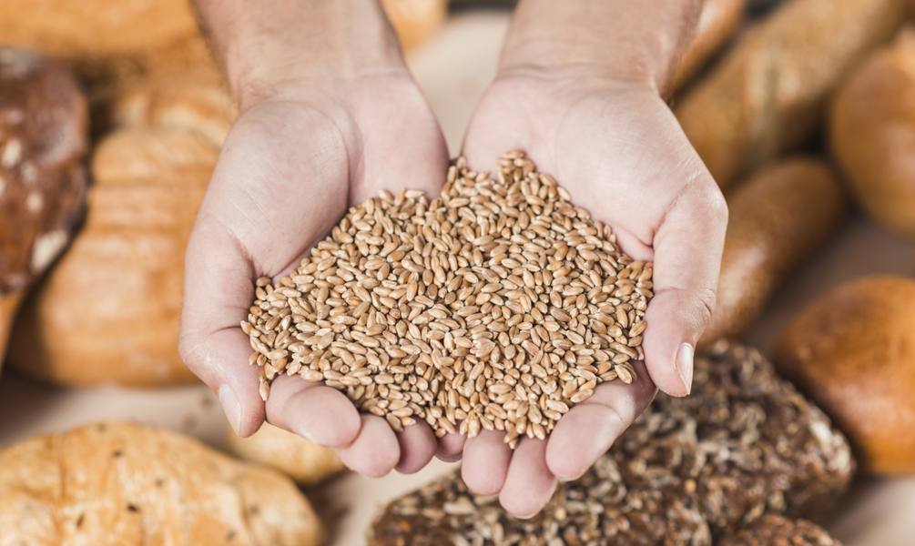 handful-wheat-grains-baked-fresh-bread