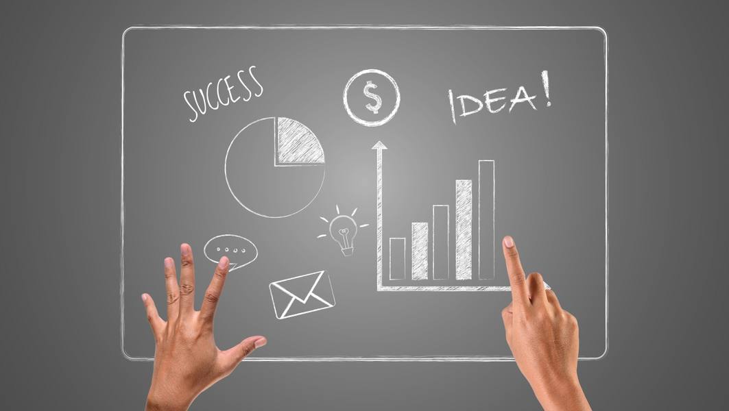 hands-pointing-successful-graphs-written-with-white-chalk-draw-concept