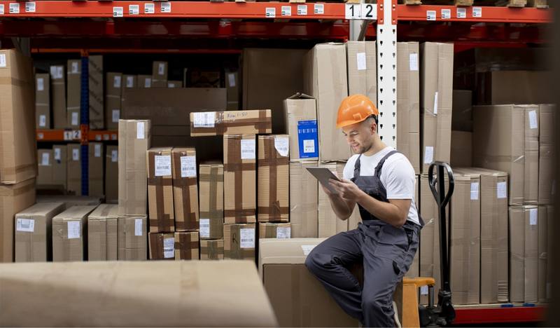 medium-shot-man-sitting-warehouse