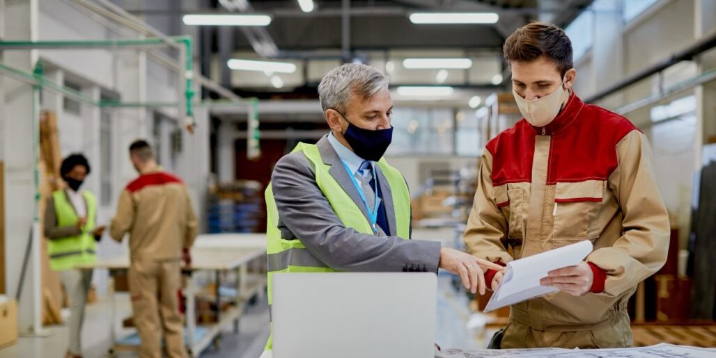 mid-adult-engineer-male-worker-wearing-face-masks-while-examining-paperwork-woodworking-factory-1028x615
