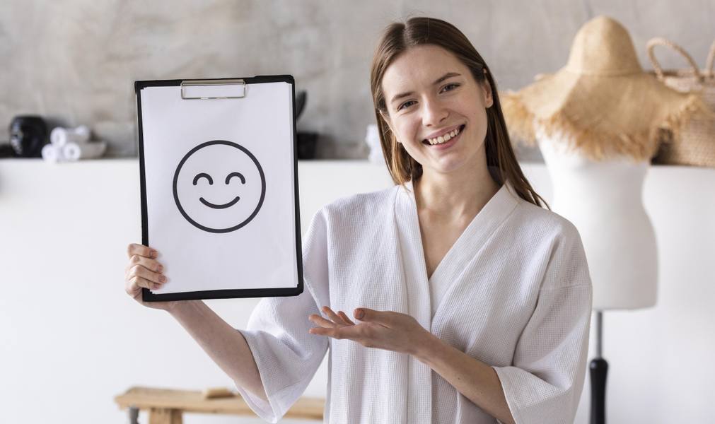 positive-woman-holding-clipboard-with-smiley-face