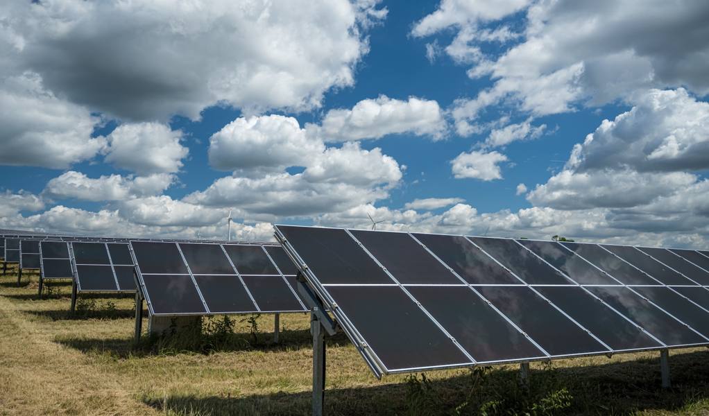 solar-panels-used-renewable-energy-field-sky-full-clouds