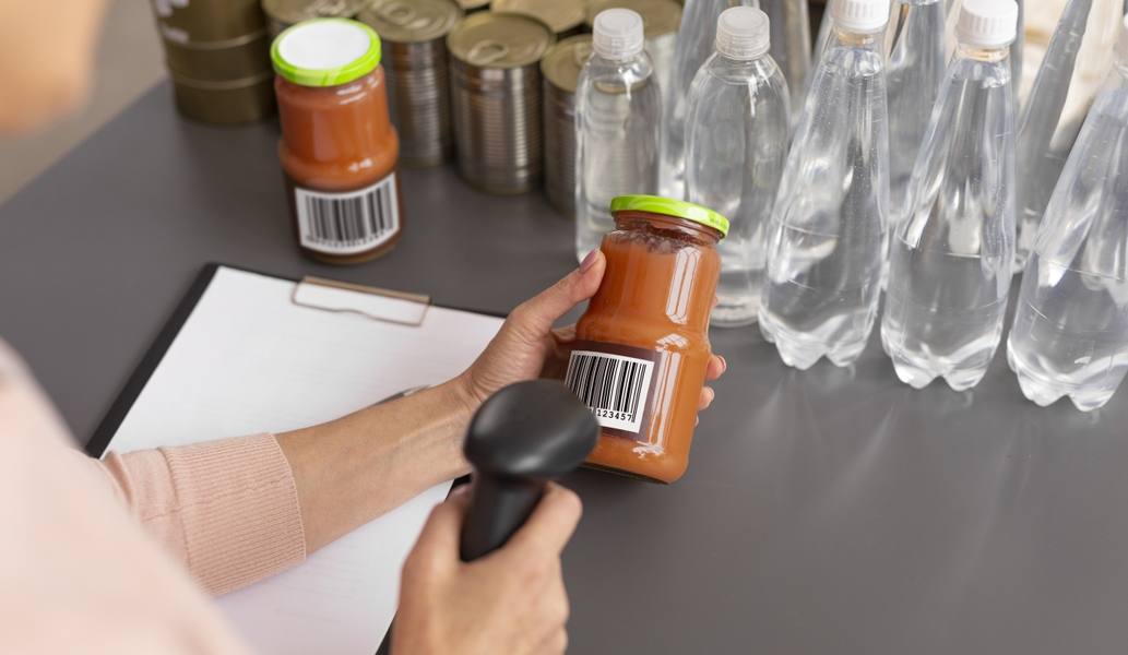 volunteer-scanning-food-donations-charity