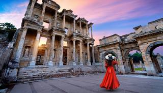 woman-standing-celsus-library-ephesus-ancient-city-izmir-turkey