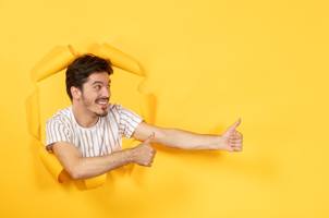 wp-0f508589891d3886-young-male-torn-yellow-paper-background-sale-facial-guy