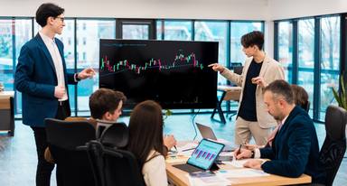 wp-2fb528ecd58958ac-two-young-worker-leading-business-meeting-about-cryptocurrencies-office