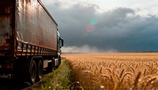 wp-45837416c5eb2f8c-truck-by-golden-wheat-field-stormy-sky