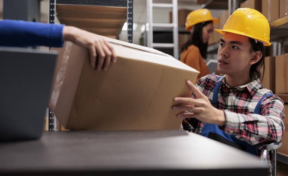wp-47a83cadee08911a-storehouse-order-picker-wheelchair-doing-order-fulfillment-taking-cardboard-box-