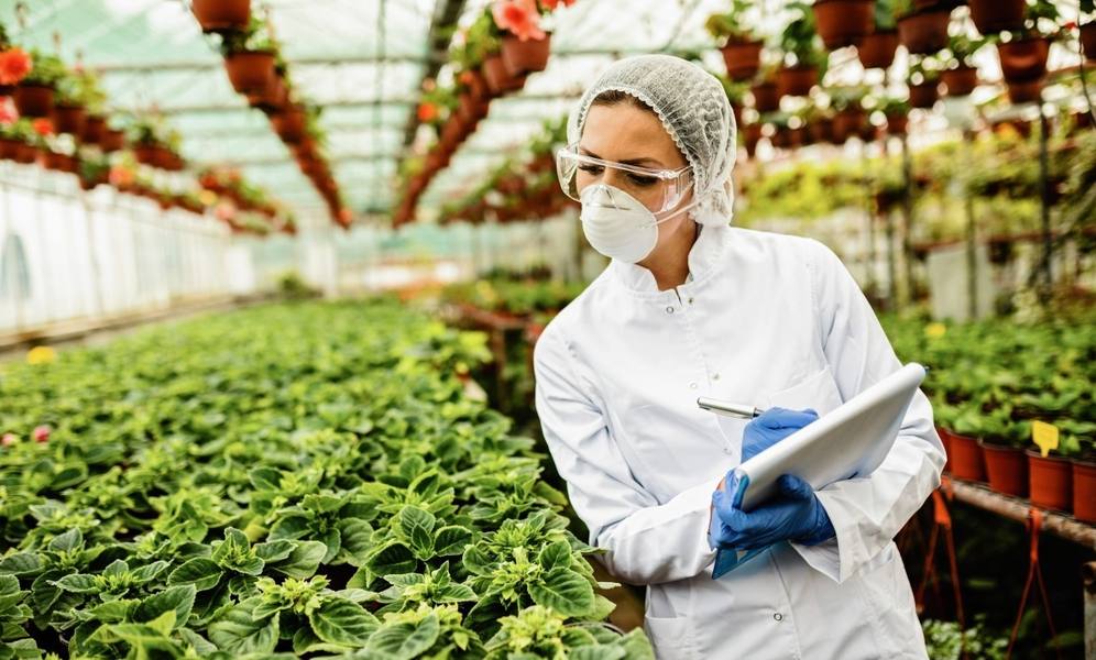 wp-4e4a13b921b4a415-female-scientist-writing-report-quality-control-inspection-plant-nursery