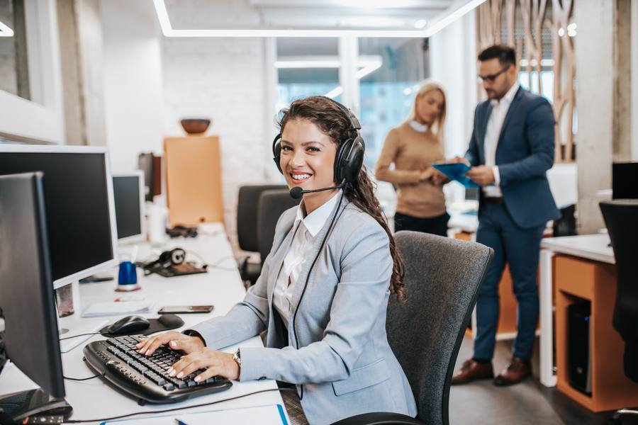 wp-55405891bfd67f28-Beautiful,Smiling,Female,Call,Center,Worker,Accompanied,By,Her,Team