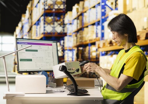 wp-586503b74a5e6424-asian-depot-worker-scanning-barcodes-packages-warehouse-reviewing-shipping-label