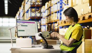 wp-586503b74a5e6424-asian-depot-worker-scanning-barcodes-packages-warehouse-reviewing-shipping-label