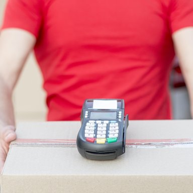 wp-619793670407c7b8-close-up-guy-holding-box-pos-machine