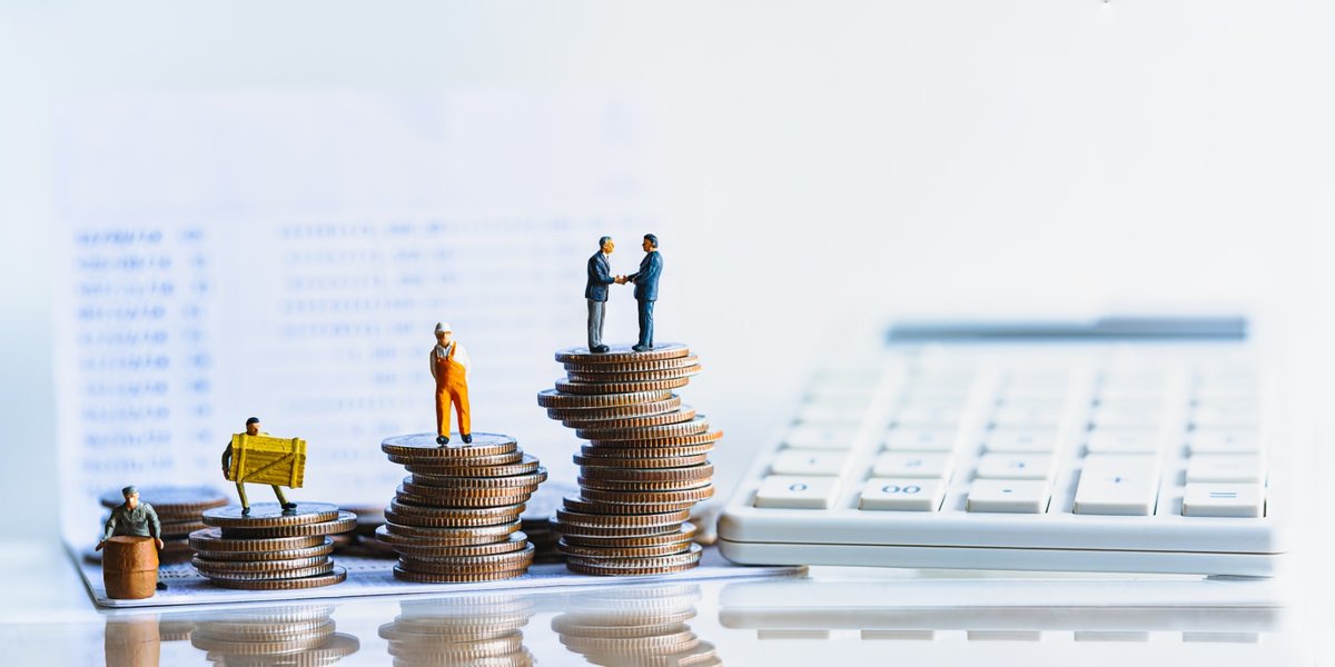 wp-8fa899ff4b3af81c-Miniature,People,Standing,On,A,Pile,Of,Coins.,Inequality,And