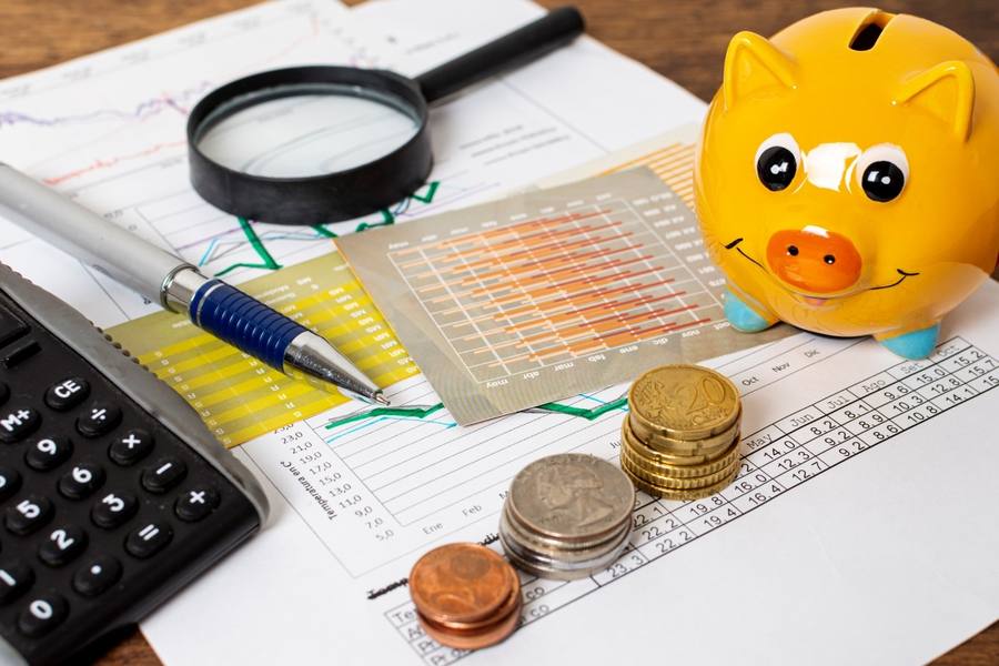 wp-94469a5cc5a1c73a-high-view-piggy-bank-piles-coins