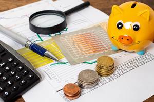 wp-94469a5cc5a1c73a-high-view-piggy-bank-piles-coins