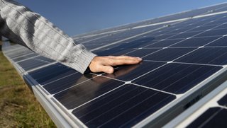 wp-b47759fa04d66c09-person-near-alternative-energy-plant