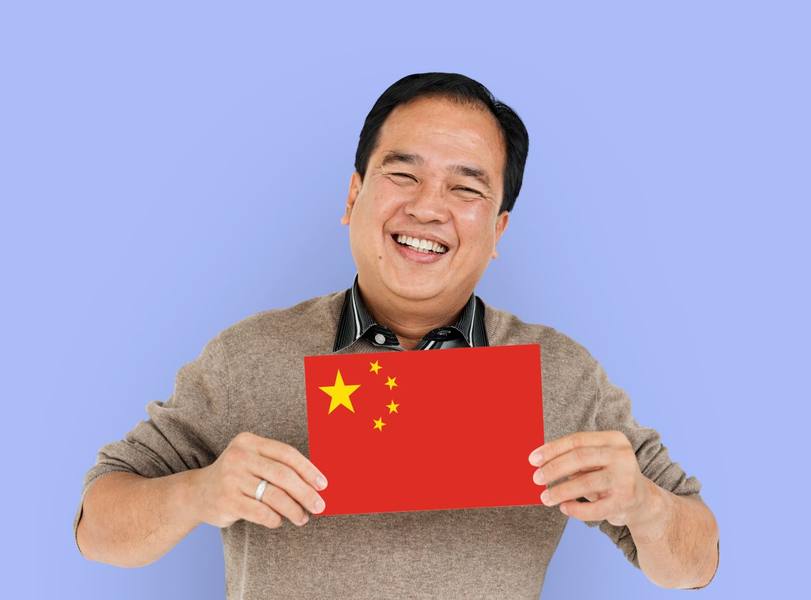 wp-ec9d2710e3140329-man-hands-hold-china-flag-patriotism