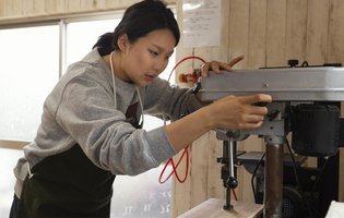 wp-ee791768ee791fa6-asian-woman-working-with-wood